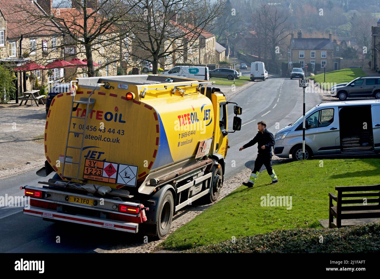 Tate oil lorry, delivering domestic heating oil to house in the village of Coxwold, in Hambleton district, North Yorkshire, England UK Stock Photo
