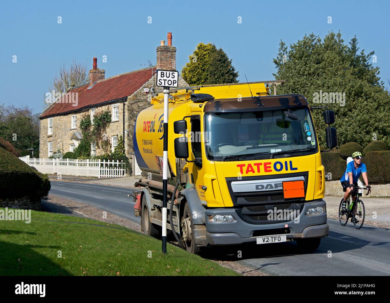 Tate oil lorry, delivering domestic heating oil to house in the village of Coxwold, in Hambleton district, North Yorkshire, England UK Stock Photo