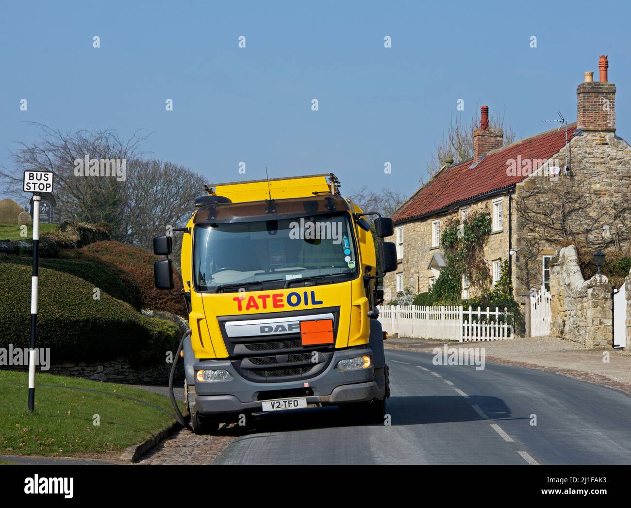 Tate oil lorry, delivering domestic heating oil to house in the village