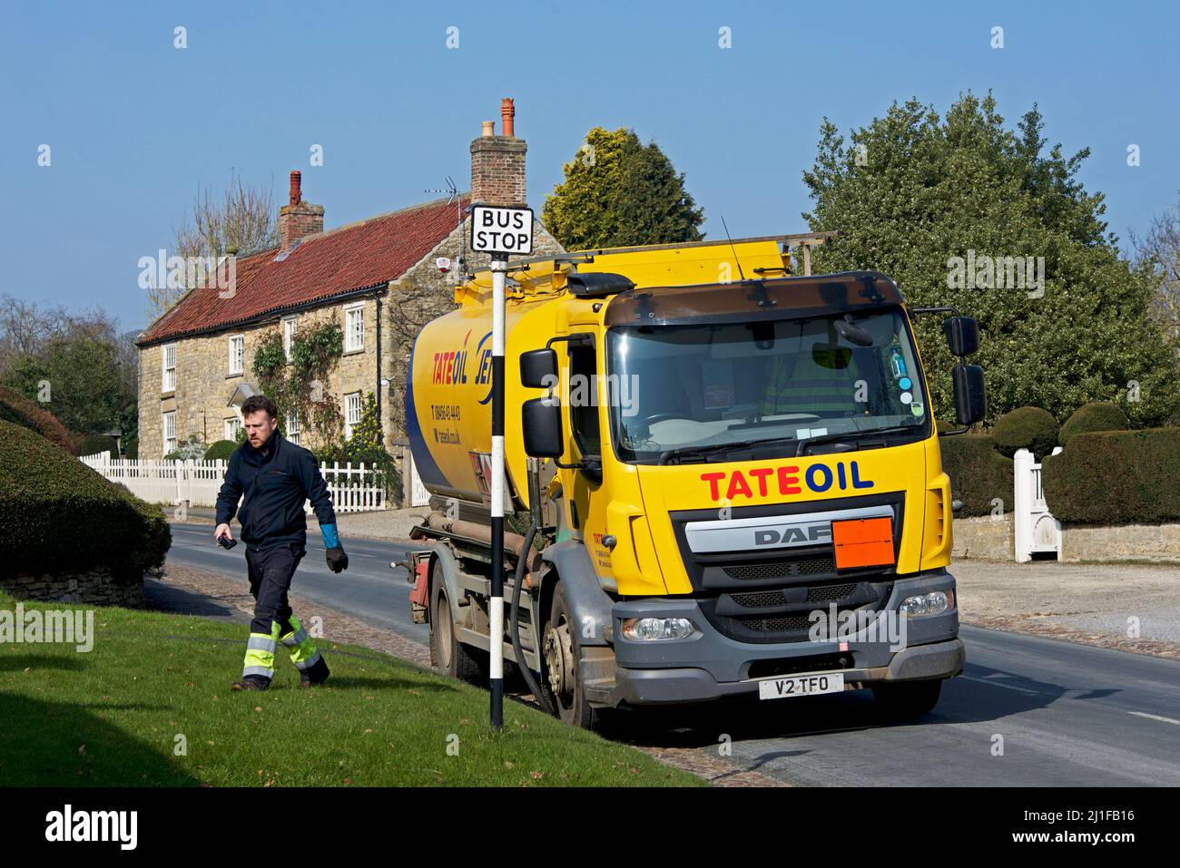 Tate oil lorry, delivering domestic heating oil to house in the village