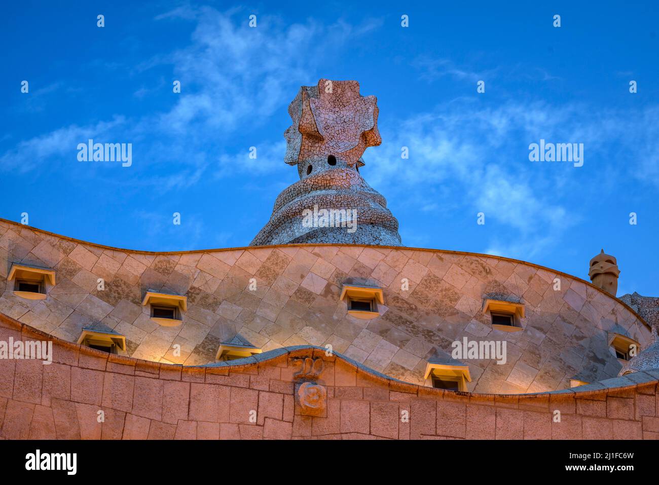 Casa Milà (La Pedrera) at sunset, twilight and blue hour on the Passeig de Gracia in Barcelona (Catalonia, Spain) ESP: La Casa Milà al atardecer (BCN) Stock Photo