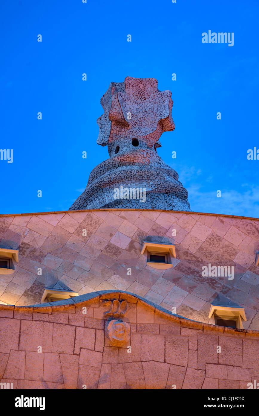 Casa Milà (La Pedrera) at sunset, twilight and blue hour on the Passeig de Gracia in Barcelona (Catalonia, Spain) ESP: La Casa Milà al atardecer (BCN) Stock Photo