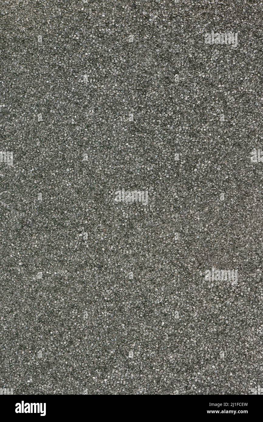 Gray or black sponge foam pile background. High resolution photo. Full depth of field. Stock Photo