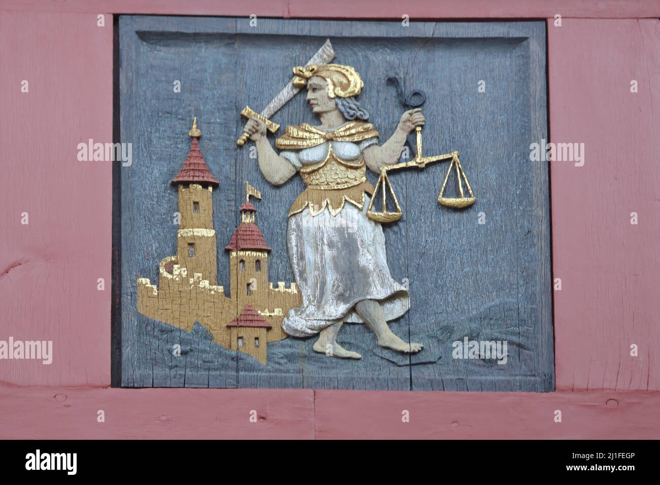 Lady Justice as a wood carving on the town hall, Herborn, Hesse, Germany Stock Photo