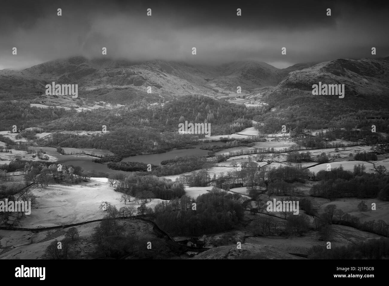 A black and white image of Rydal Water from Loughrigg Fell in the Lake District National Park, Cumbria, England. Stock Photo
