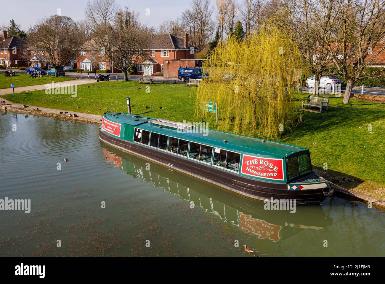 Boating the narrowboat 'The Rose of Hungerford' moored on the banks of