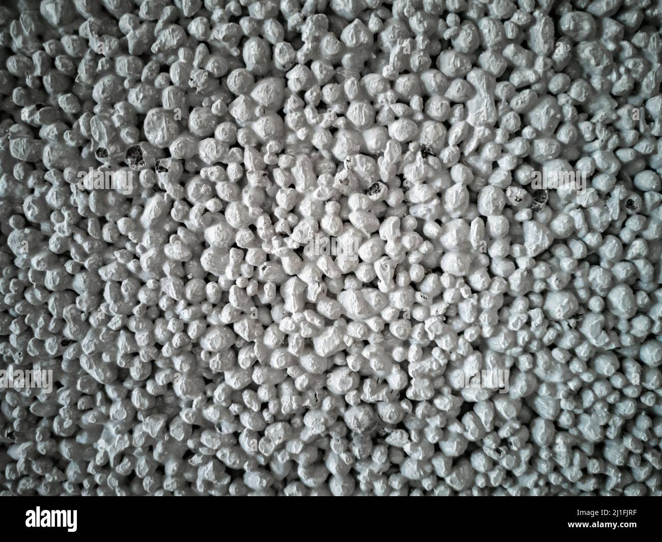 Dark gray background of a waterproofing foam block for a bathroom. Construction and repair