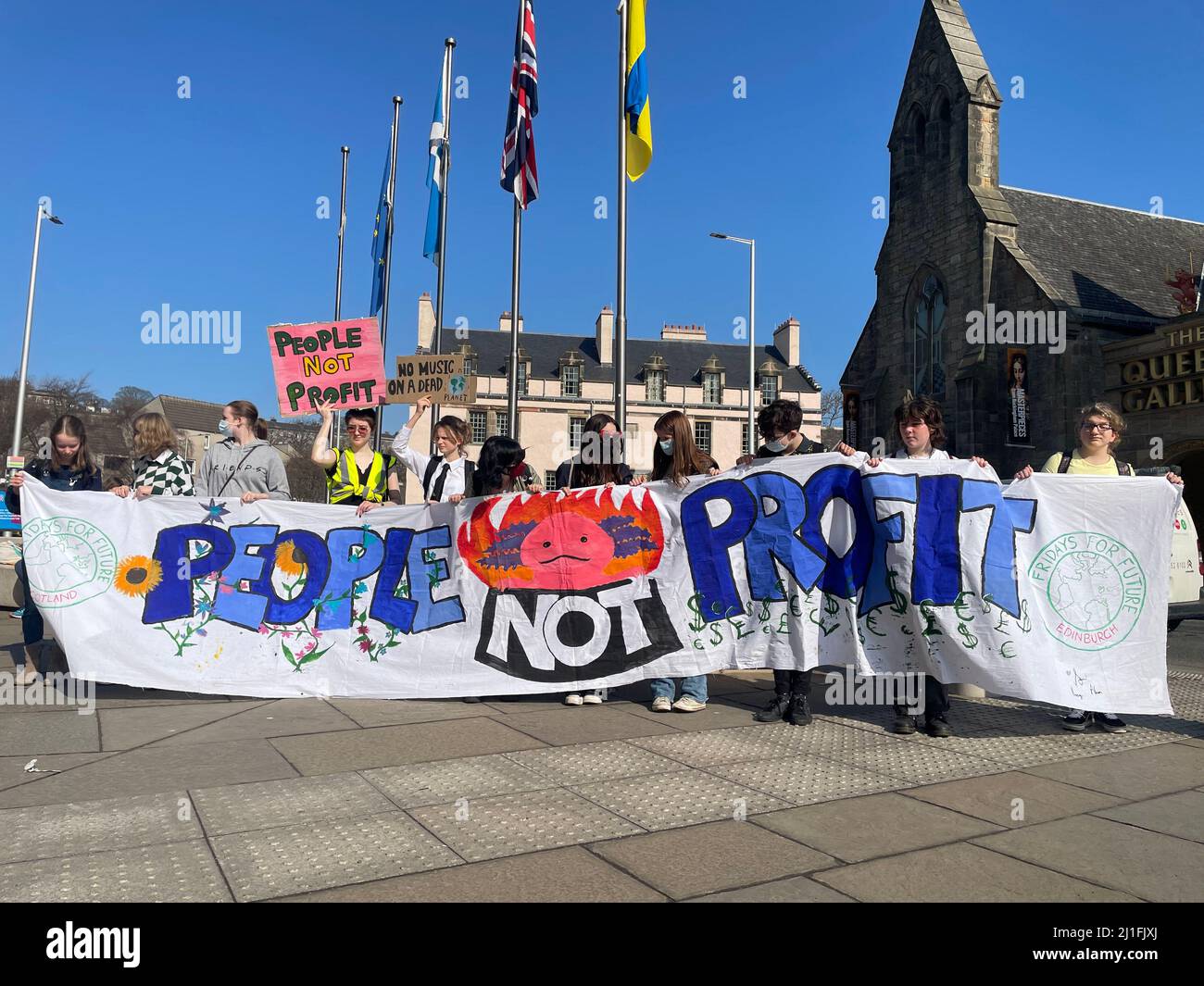 EDITORSS NOTE LANGUAGE ON PLACARD Hundreds of school strikers march through Edinburgh at the Friday's for Future rally, demanding the government does more to clamp down on harmful emissions and take action on climate change. Picture date: Friday March 25, 2022. Stock Photo