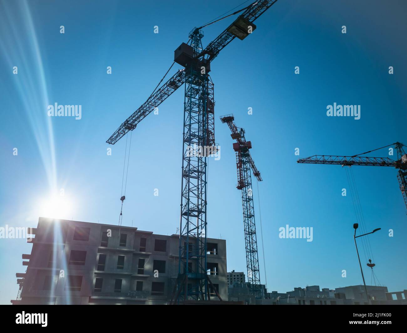 Construction of panel high-rise buildings.Tower cranes at the ...