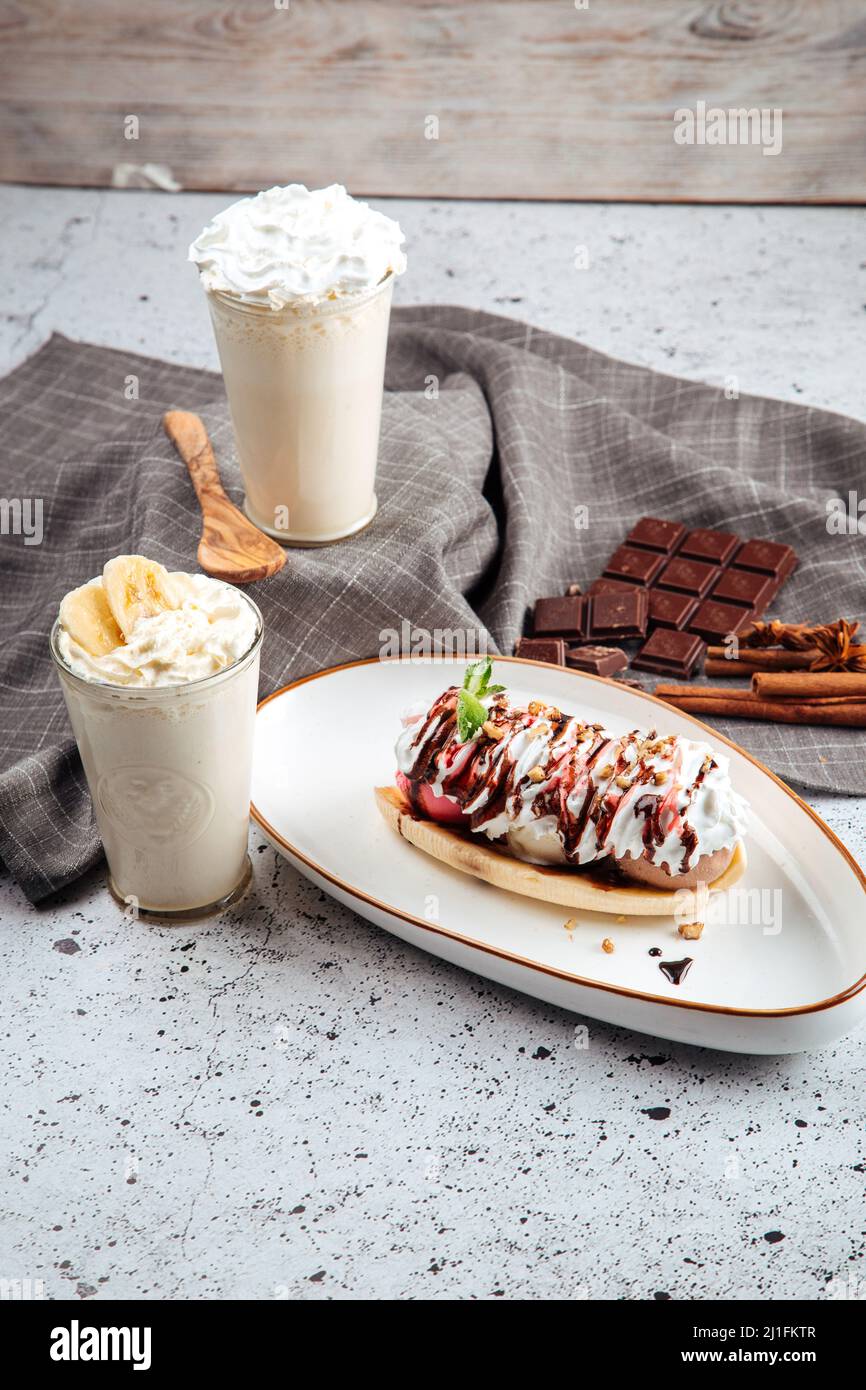 Banana split dessert with nuts with milkshakes Stock Photo Alamy