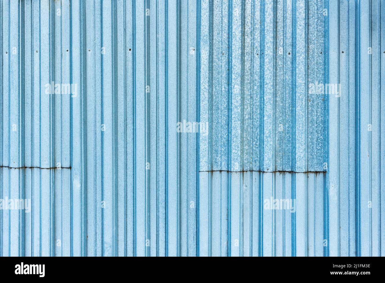 White and blue corrugated metal fence background Stock Photo - Alamy
