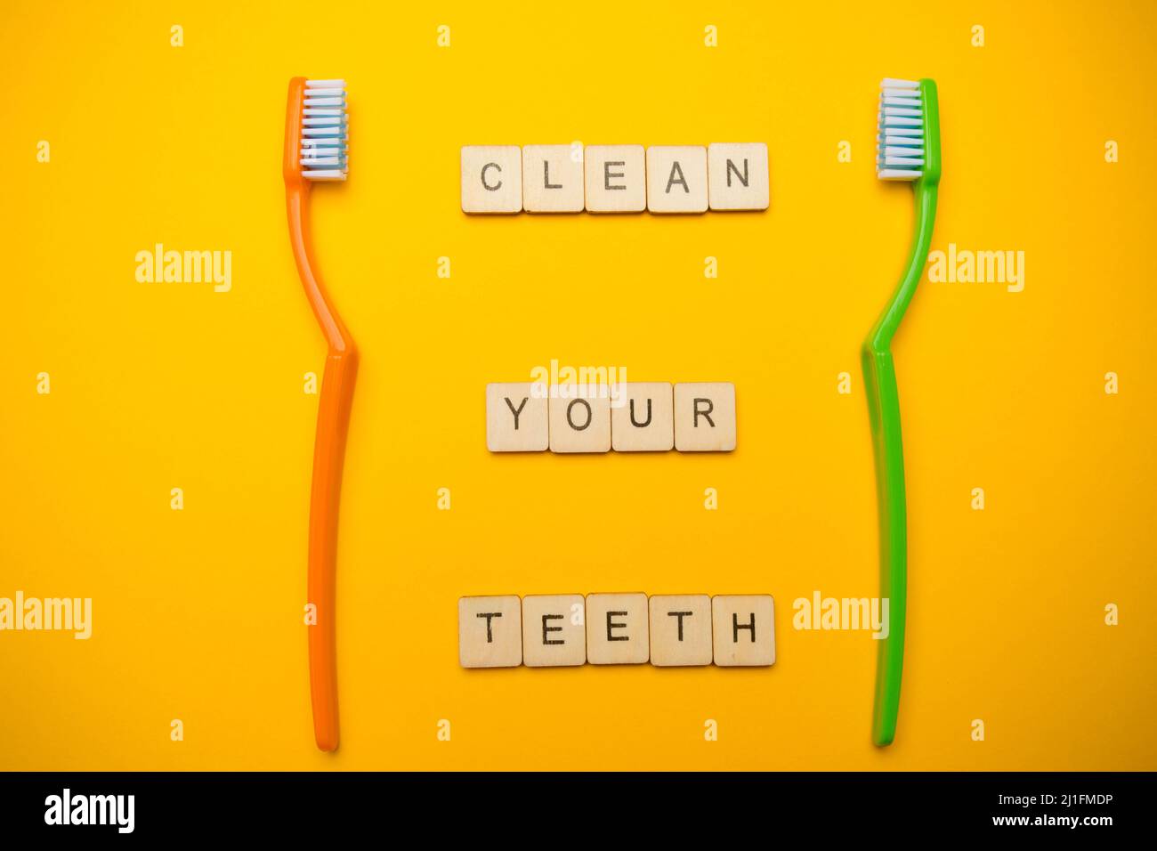 Oral and dental health concept showing two toothbrushes and a sign ...