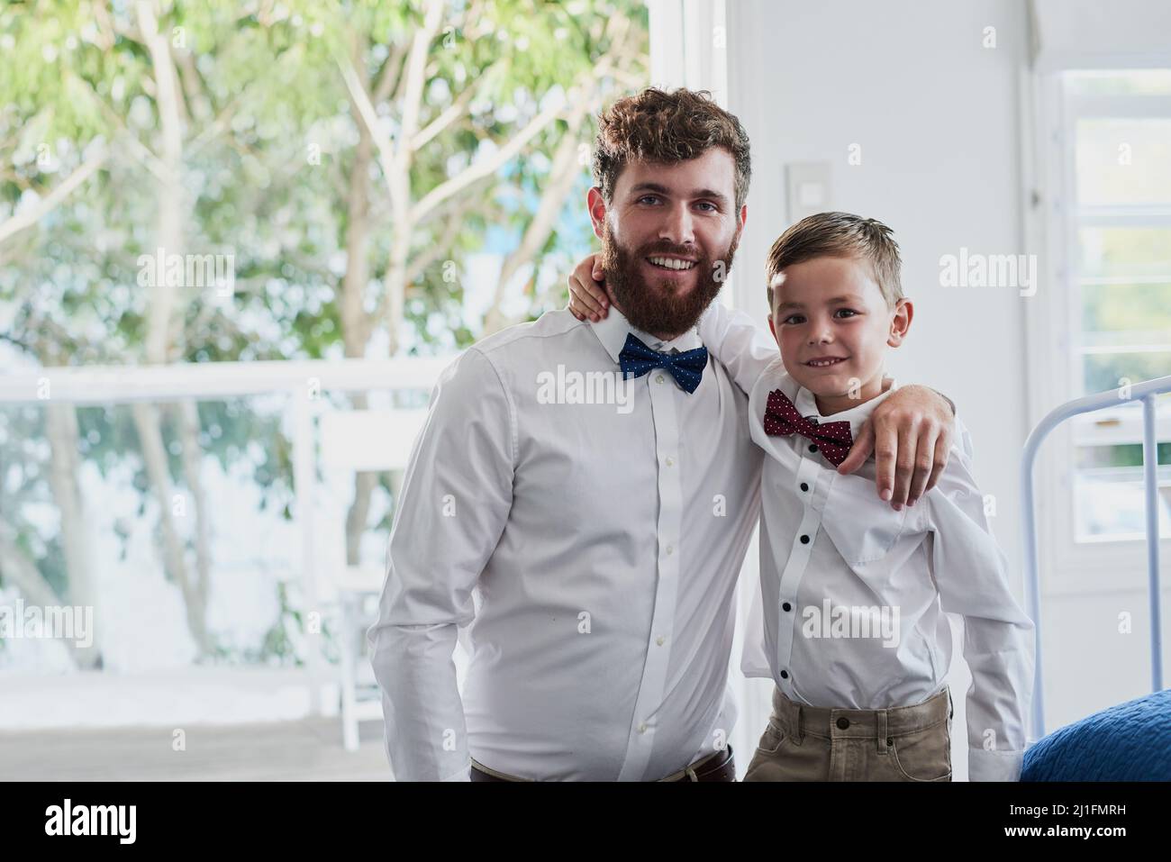 Looking dapper with Daddy. Portrait of an adorable little boy and his father dressed in matching outfits at home. Stock Photo