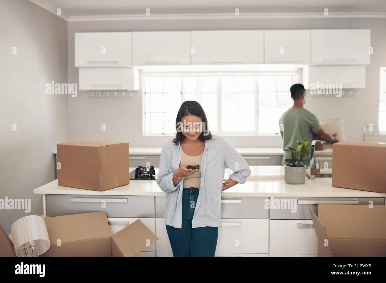 Help Unpacking Im messaging our friends to come help with the unpacking. Shot of a ...