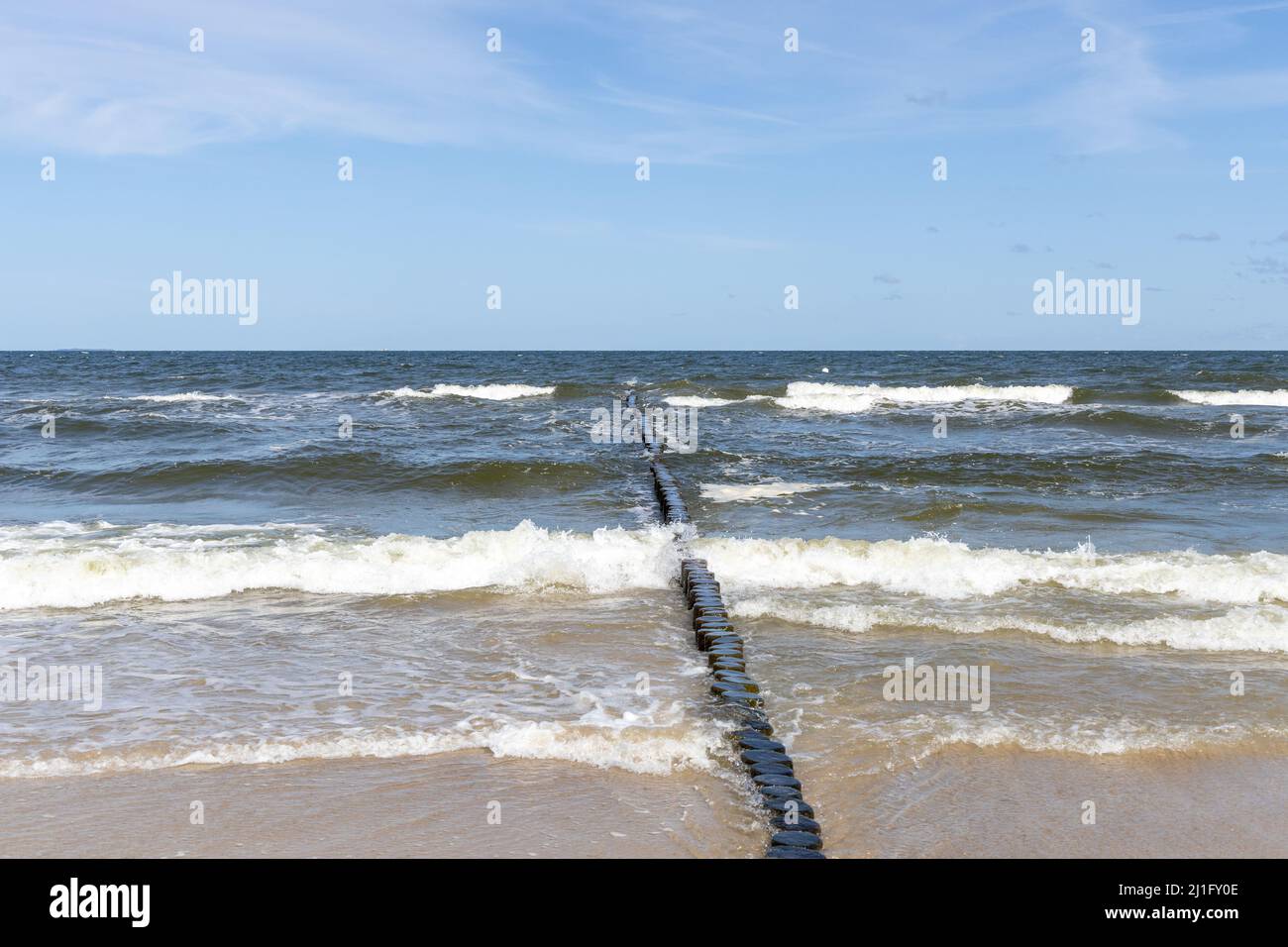 Waves on the beach of Zempin on the island of Usedom on a beautiful day in summer Stock Photo