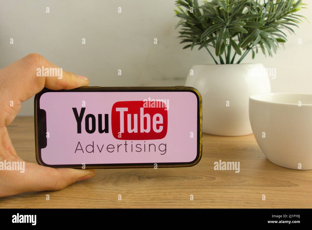 KONSKIE, POLAND - March 20, 2022: Youtube Advertising logo displayed on mobile phone. Social media marketing concept Stock Photo