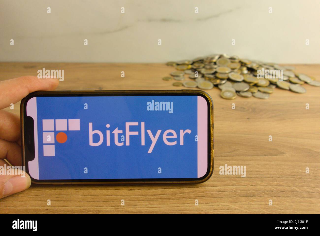 KONSKIE, POLAND - March 20, 2022: bitFlyer cryptocurrency exchange logo on mobile phone. Online trading, blockchain technology concept Stock Photo
