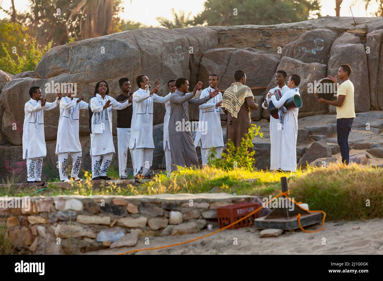 Locals dancing and chanting on the west bank of the Nile at Aswan Stock Photo