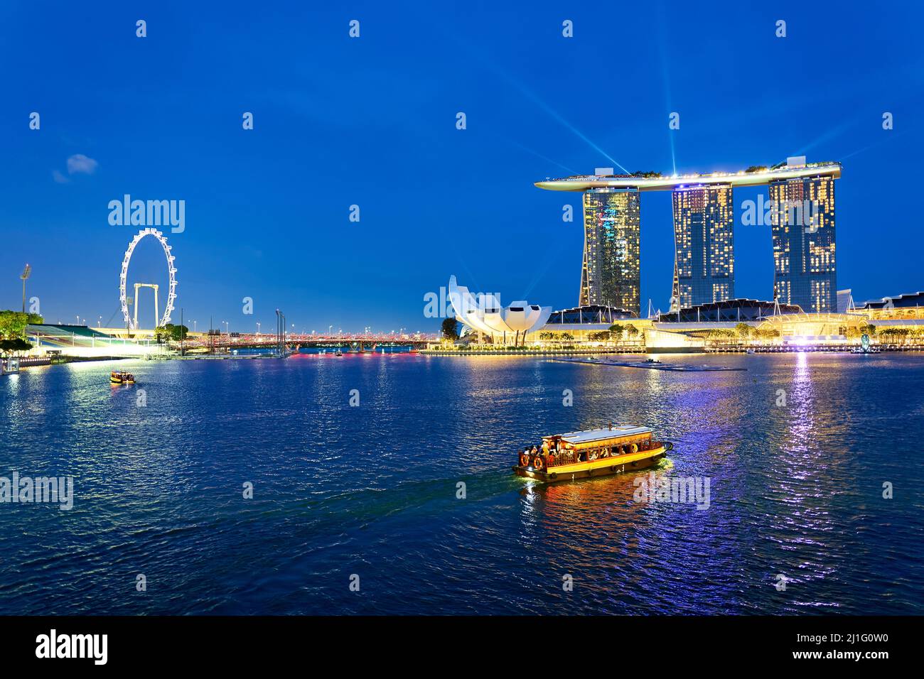 Singapore. Marina Bay. The Flyer. Marina Bay Sands Hotel at sunset Stock Photo