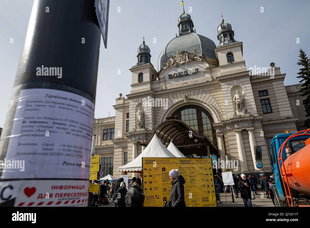 LVIV, UKRAINE - March 12, 2022: Humanitarian crisis during the war in Ukraine. Volunteers helping to get information thousands of refugees flee war-to Stock Photo