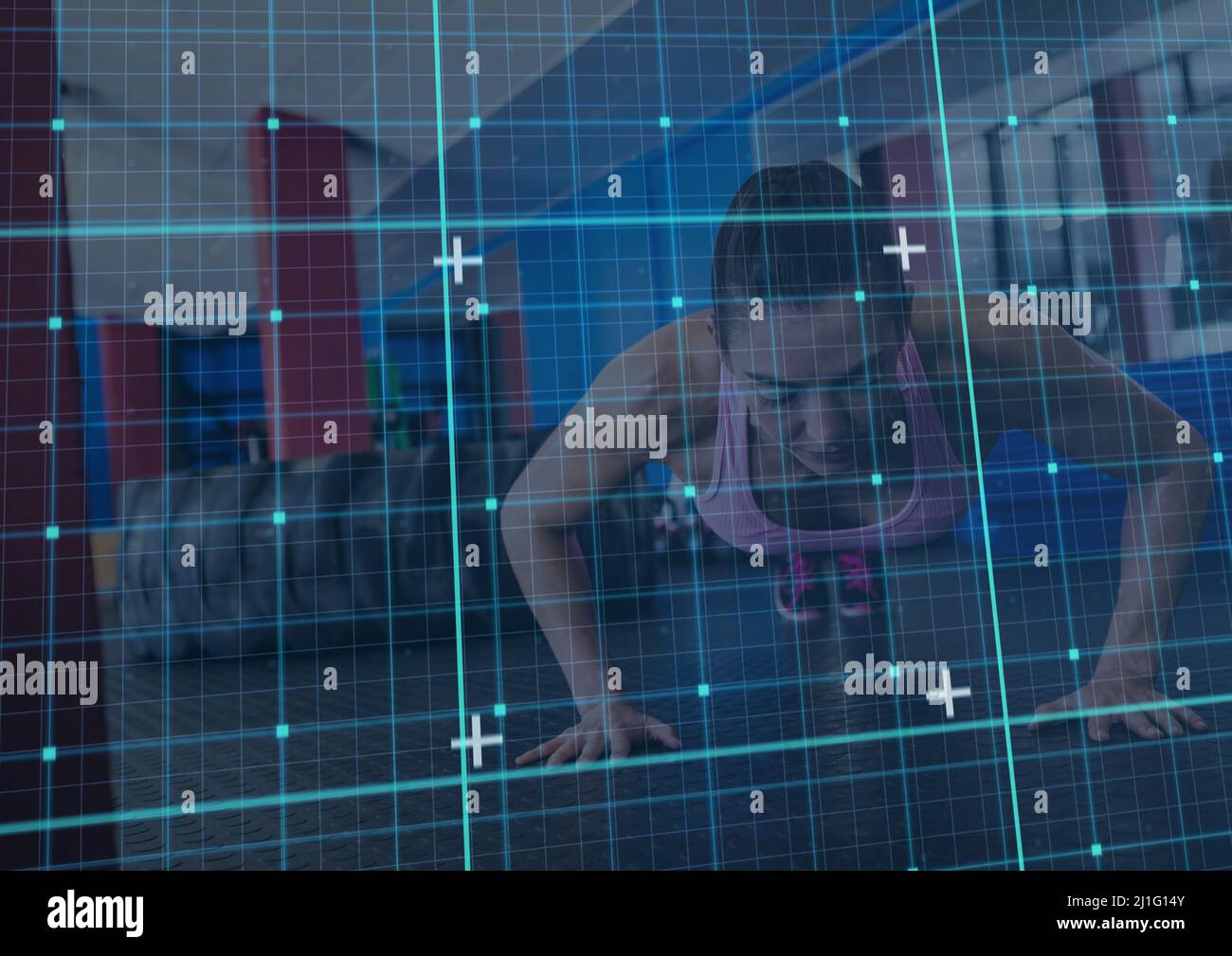 Grid network against caucasian fit woman performing push up exercise at the gym Stock Photo