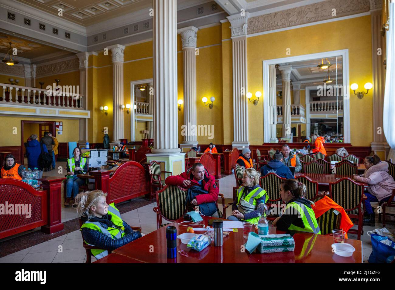 LVIV, UKRAINE -March 14, 2022: Humanitarian crisis during the war in Ukraine. Volunteers have a rest in the volunteer center at Lviv Railway Station. Stock Photo