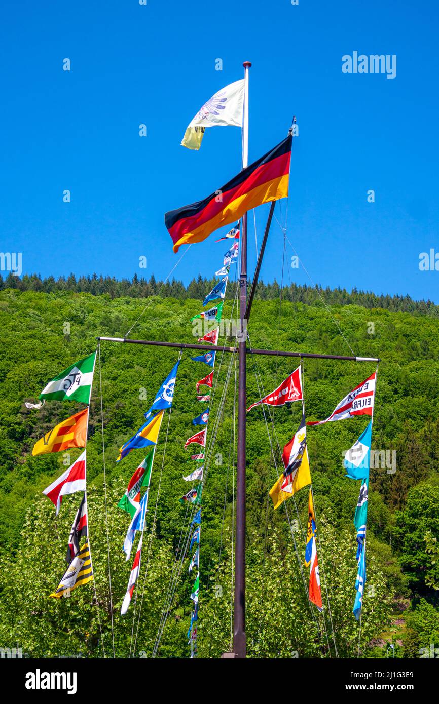 Neckargemuend, Germany: May 12, 2008: traditional Schiffermast Transation: skipper's mast in Germany decorated with many flags. These masts remind the Stock Photo