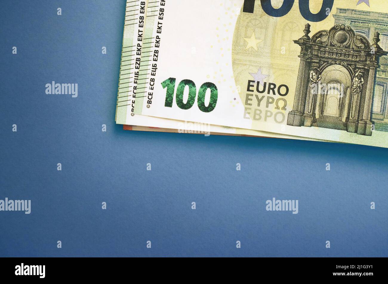 Pack of euro banknotes on blue background. European currency, business, finance Stock Photo