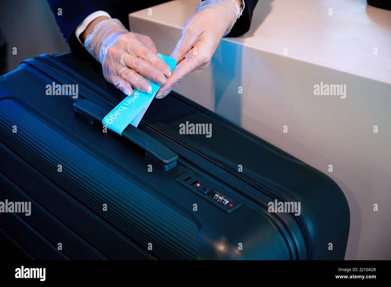 Beautiful girl checkingin passengers' baggage. Registration of luggage