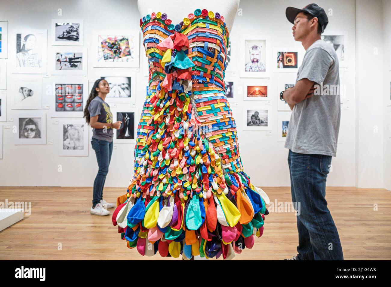 Honolulu Hawaii,Oahu,Hawaiian,Hawaii State Art Museum,Foundation on Culture & the Arts,gallery repurposed balloons installation,Asian man looking, Stock Photo