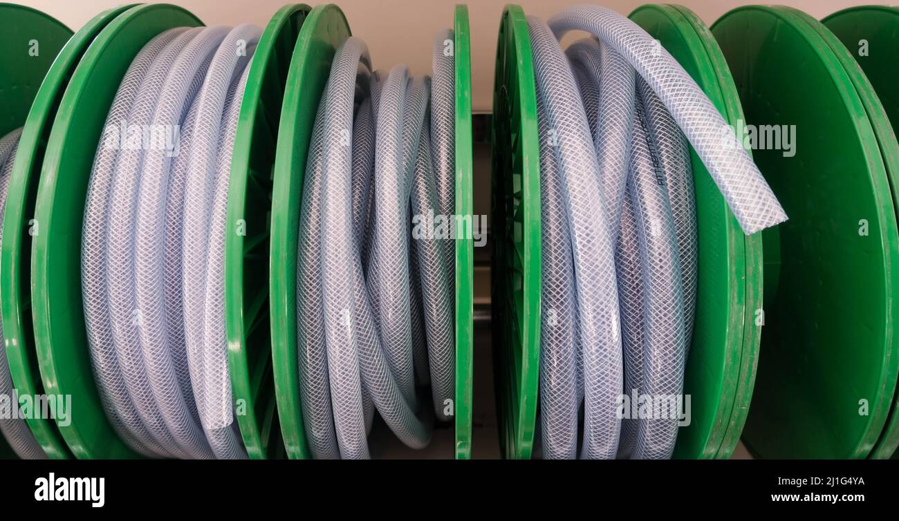 New Long White Plastic Water Hose in Roll Stock Photo Alamy