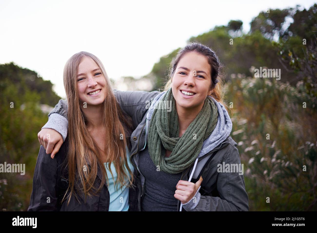 We love hiking on weekends. Portrait of two attractive young female ...