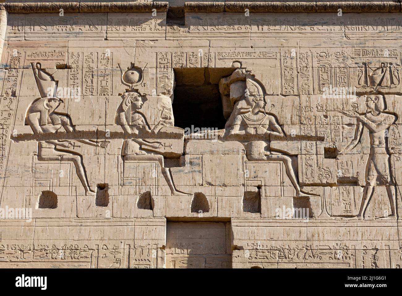 Carvings of a Ptolemaic pharaoh making offerings to the gods on the ...