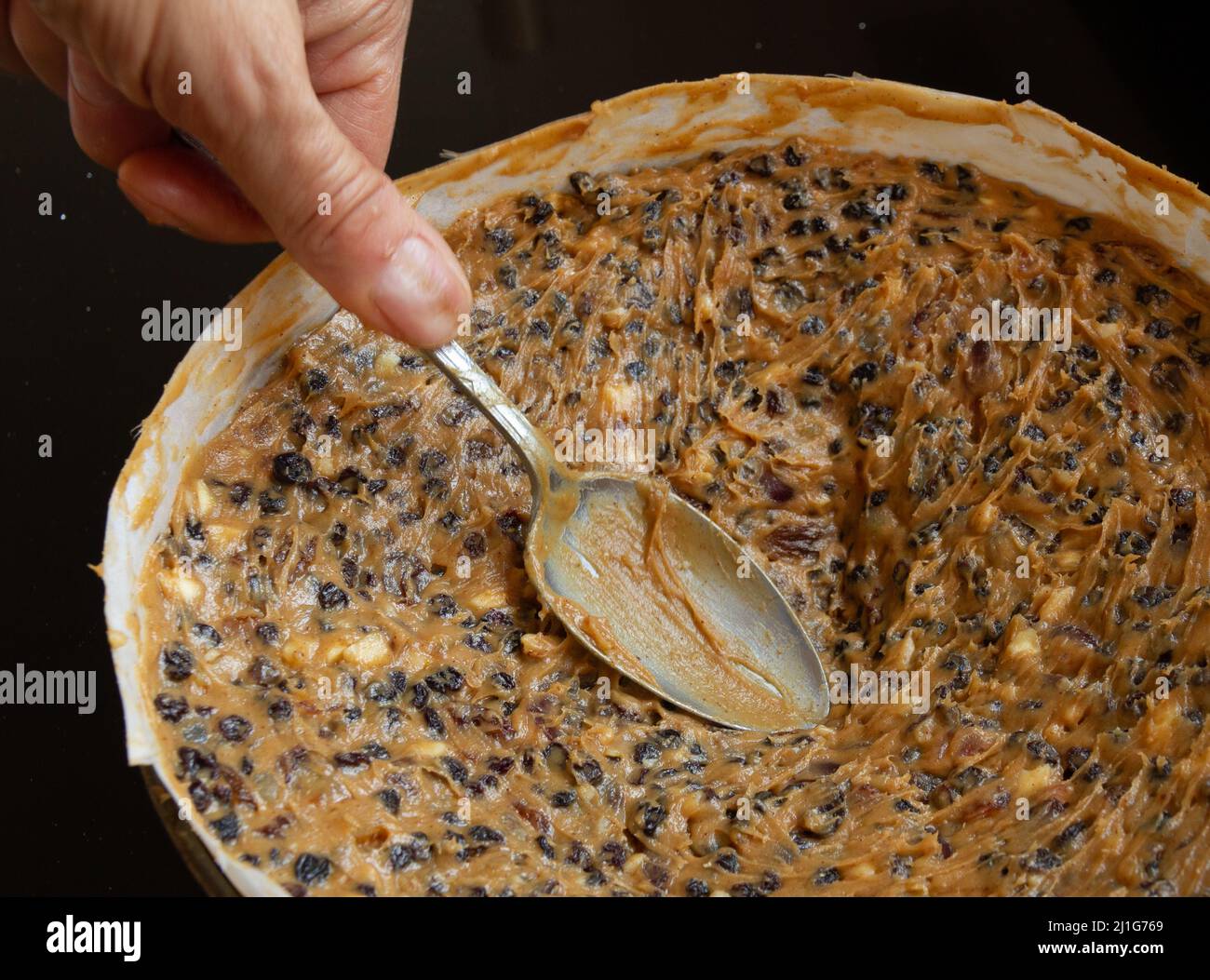 uncooked rich fruit cake in baking tin Stock Photo Alamy