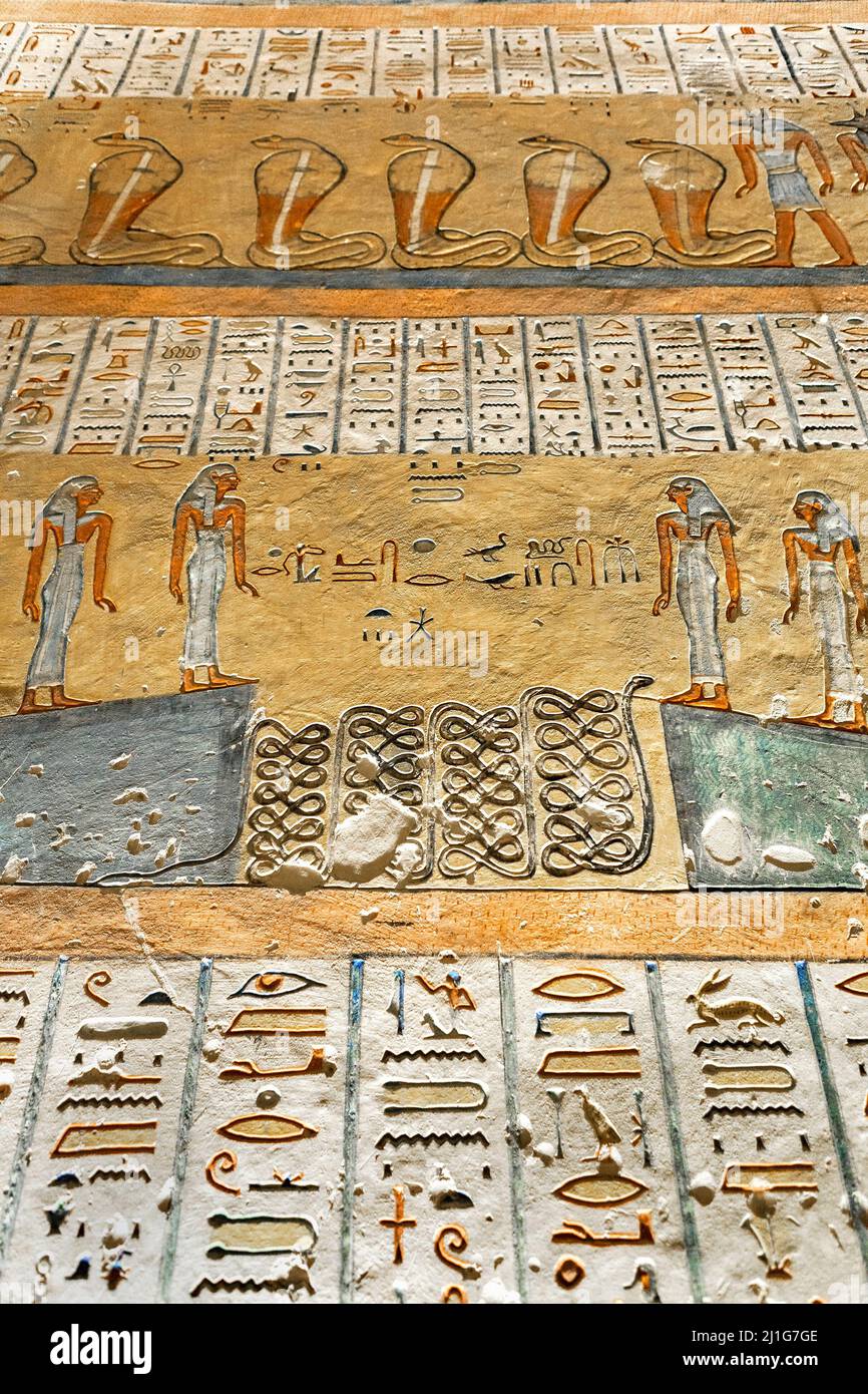 Book of Gates, fourth hour, depicting cobras and Anubis, with painted hieroglyphs in the tomb of Ramesses IV, KV2, in the Valley of the Kings Stock Photo