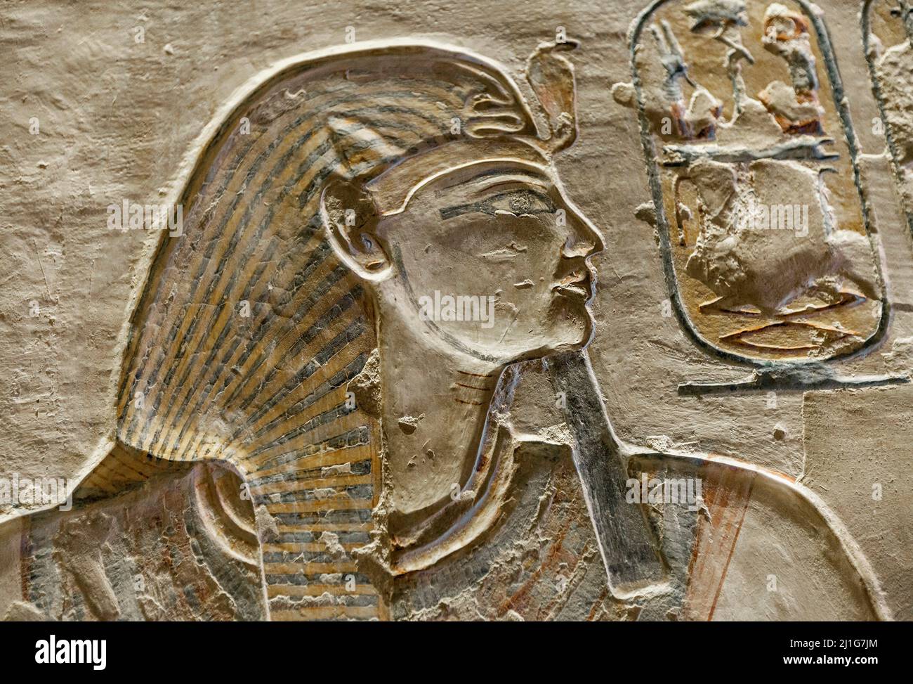 Bas-relief of the pharaoh Ramesses IX, near the defaced depiction of Hathor, in tomb KV6, the Valley of the Kings Stock Photo
