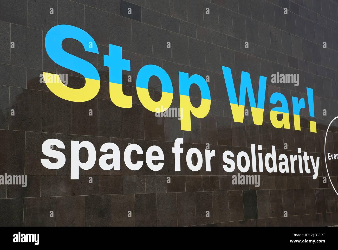 Düsseldorf (K20 Kunstsammlung), Germany - March 23. 2022: View on museum wall with text stop war as sign for solidarity for ukrainians Stock Photo