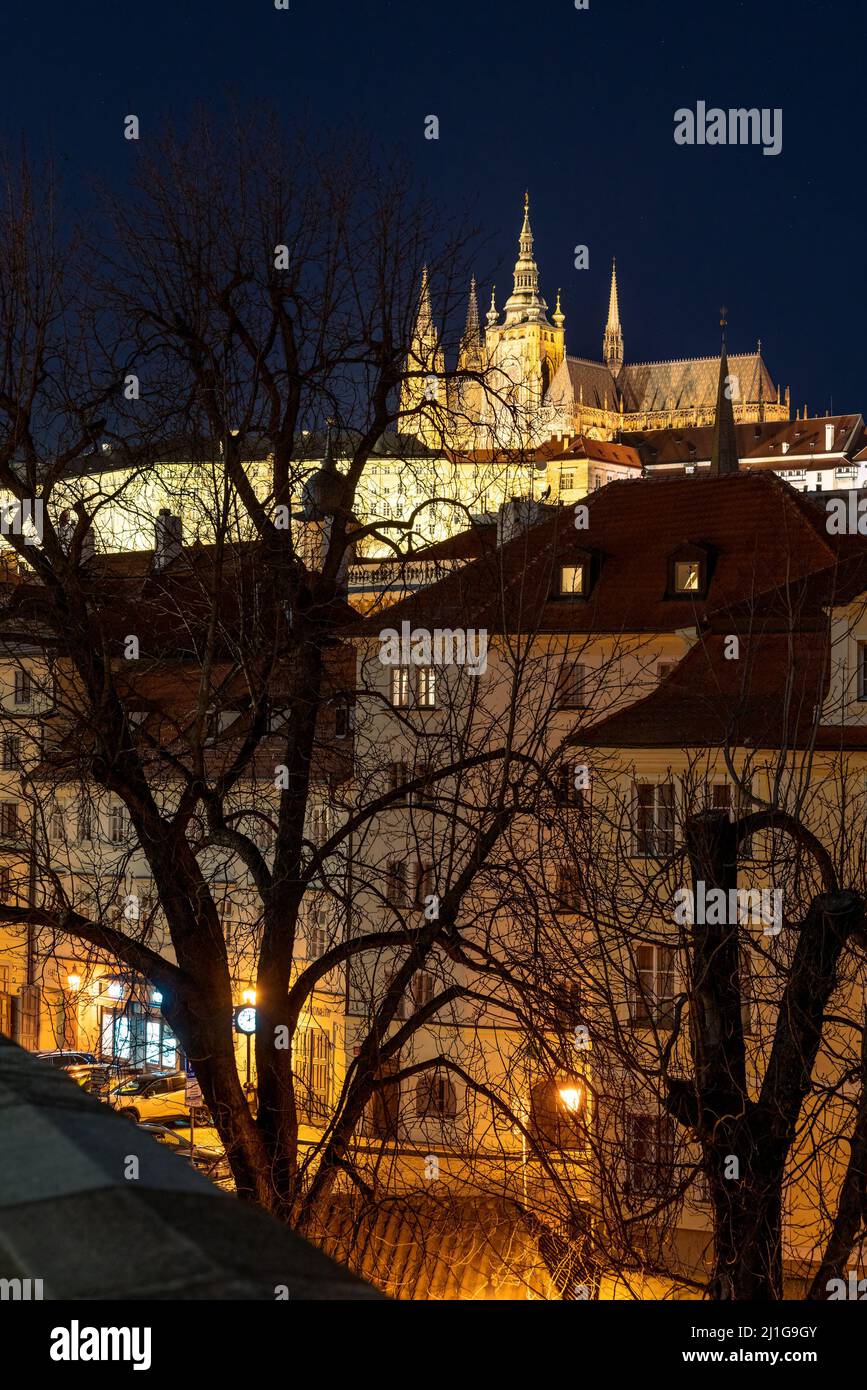 Prague, Czechia - 02.17.2022: View of Prague Castlefrom Charles Bridge in the dark night. Prague center without people. Beautiful historical buildings Stock Photo
