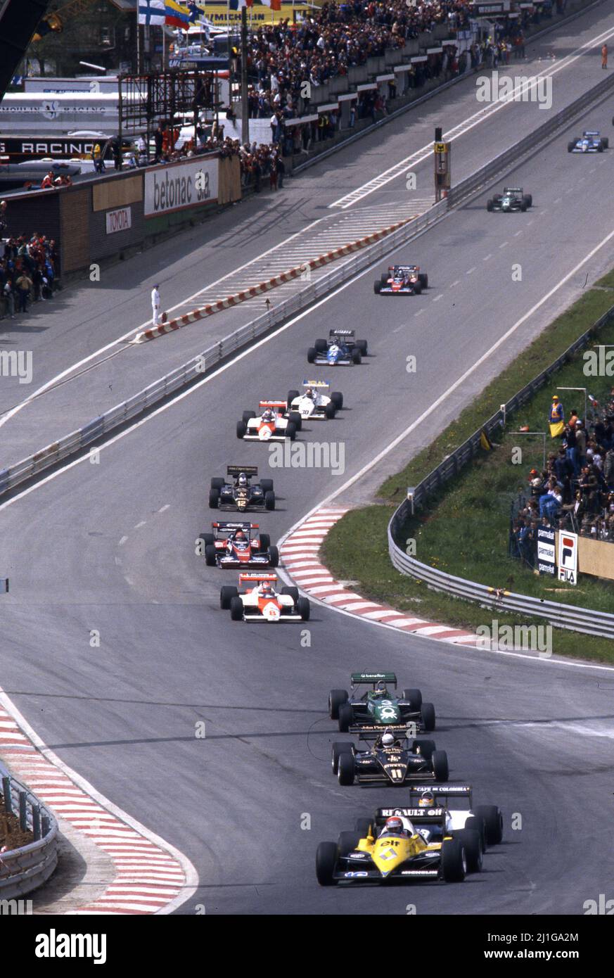Eddie Cheever (USA) Renault RE 40 3rd position leads a group at Eau Rouge Radillon corner Stock Photo
