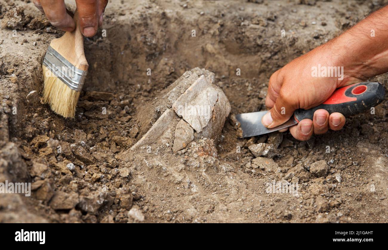 Archaeological excavations, archaeologists work, dig up an ancient clay