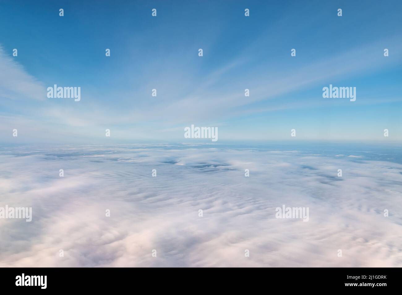 Blue sky above the clouds. Stock Photo