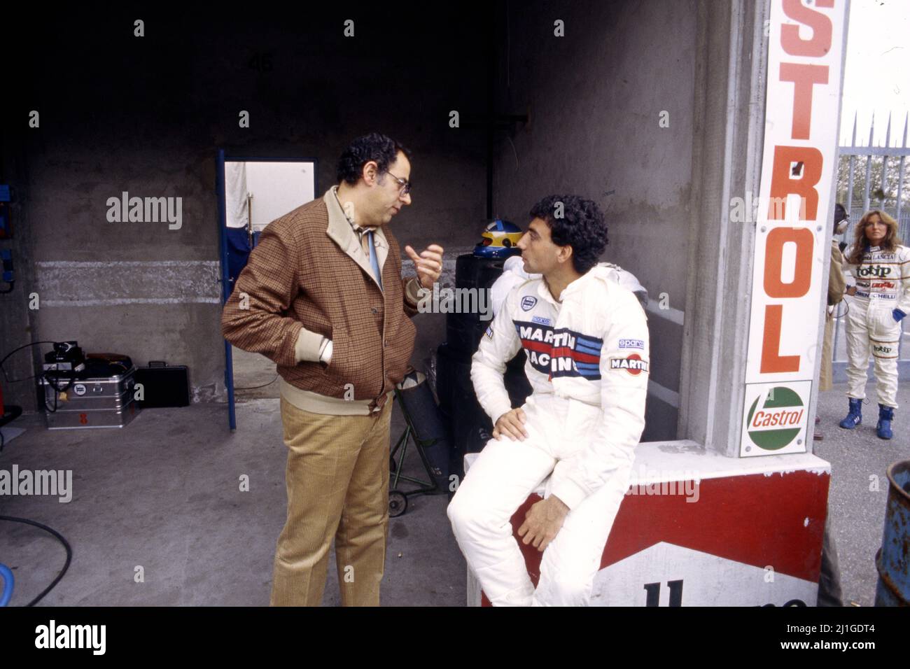 Michele Alboreto ITA Lancia Martini talks with Benigno Ben