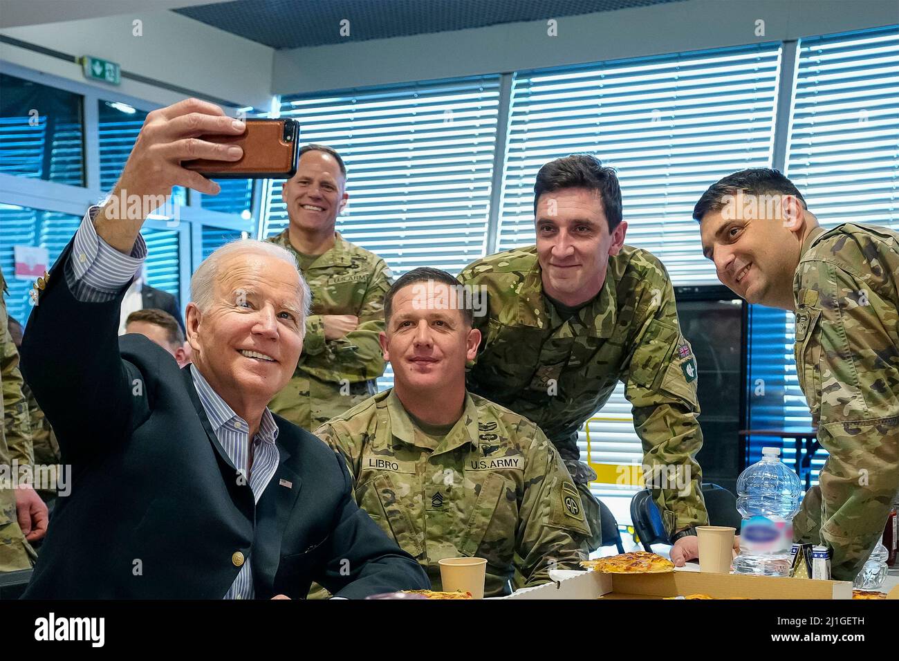 Rzeszow, Poland. 25th Mar, 2022. U.S President Joe Biden, takes a selfie with members of the U.S. Army 82nd Airborne Division during a visit March 25, 2022 in Rzeszow, Poland. Credit: Adam Schultz/White House Photo/Alamy Live News Stock Photo