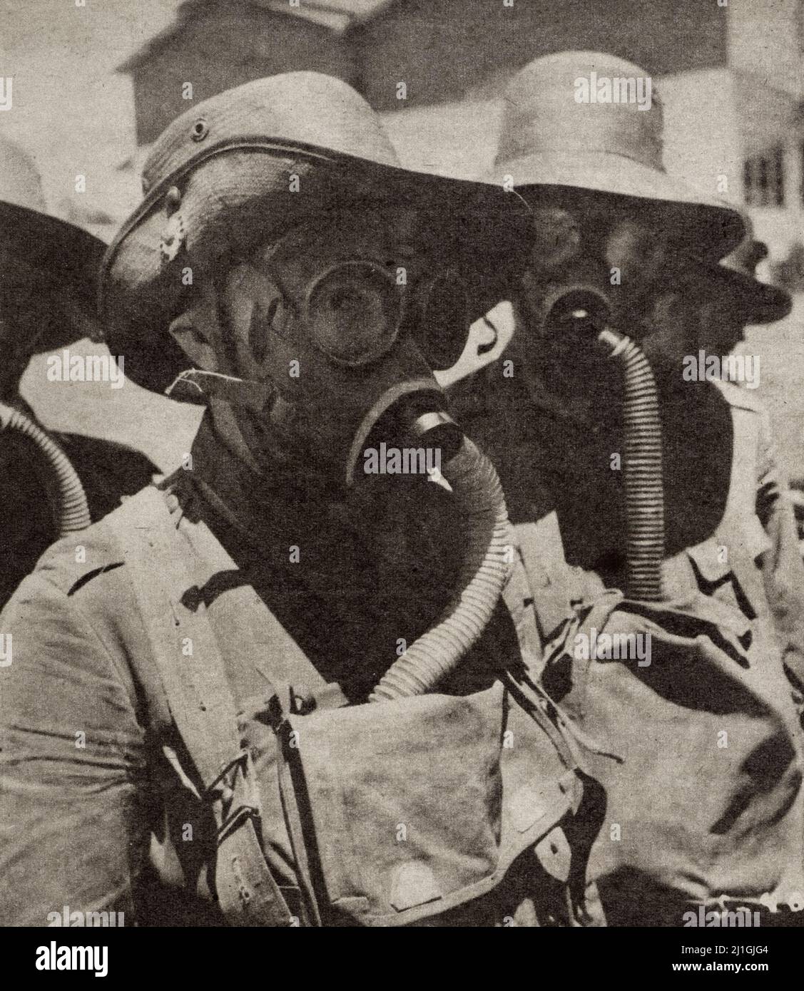 World War II period. Holland in battle. 1942 A new model of gas masks is used by the Dutch East Indies army. Stock Photo