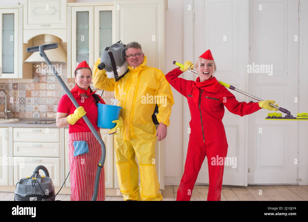 A cleaning company team with detergents in the apartment, preparing for cleaning Stock Photo