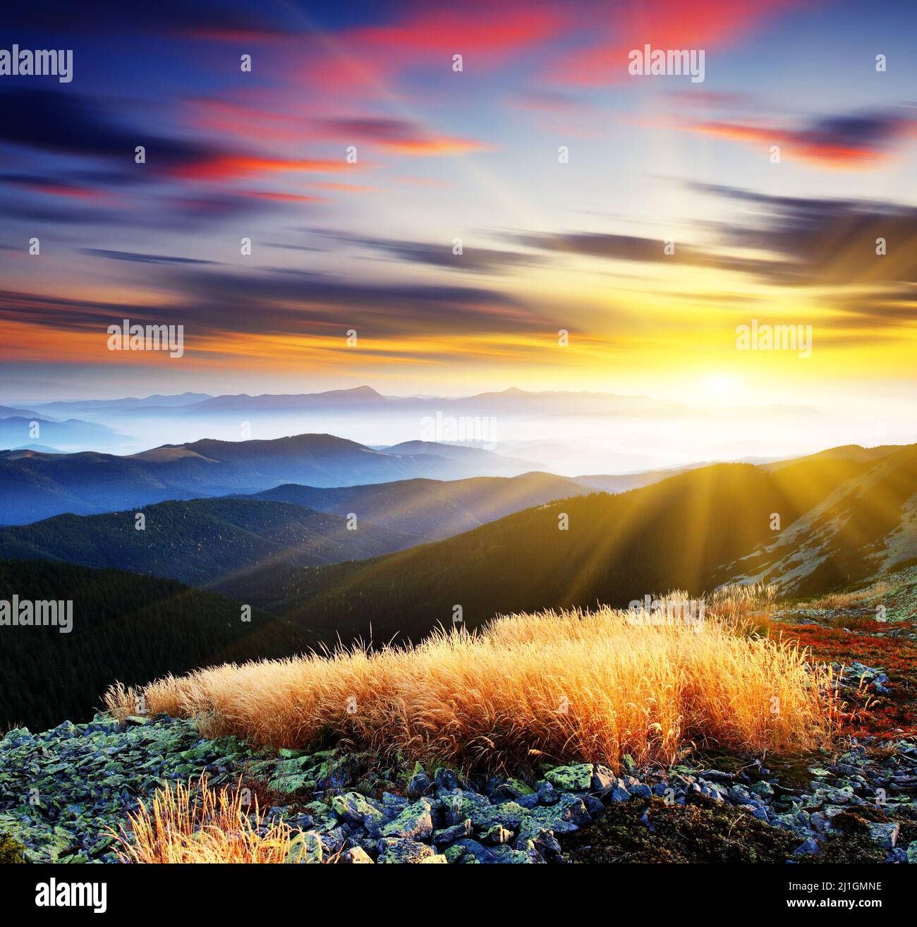 Majestic sunset in the mountains landscape. HDR image Stock Photo - Alamy