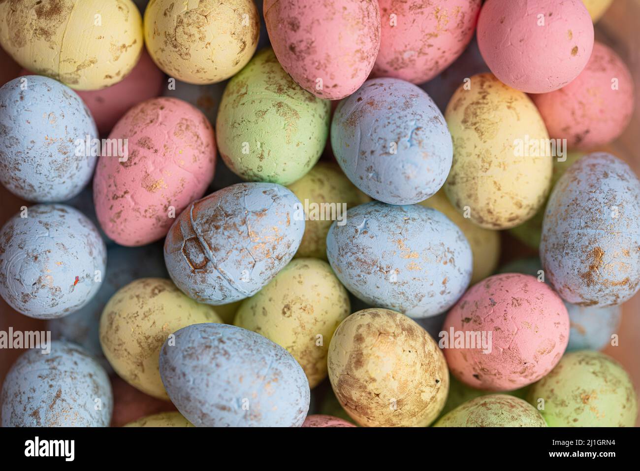 closeup of colorful small eggs background. Easter wallpaper Stock Photo