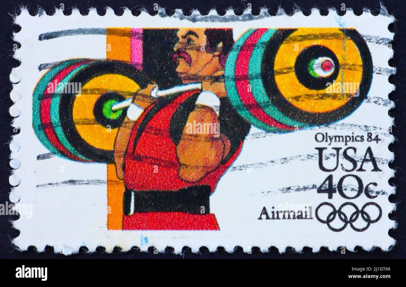 UNITED STATES OF AMERICA - CIRCA 1983: a stamp printed in the United States of America shows Weightlifting, Olympic Games 1984, Los Angeles, circa 198 Stock Photo