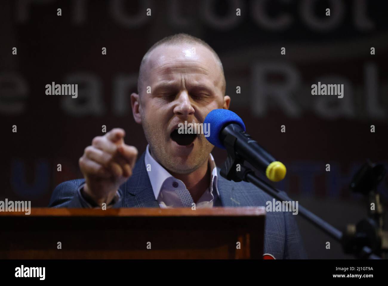 Loyalist blogger Jamie Bryson speaks during a anti Northern Ireland Protocol rally and parade, organised by North Antrim Amalgamated Orange Committee, in Ballymoney, Co Antrim. Picture date: Friday March 25, 2022. Stock Photo