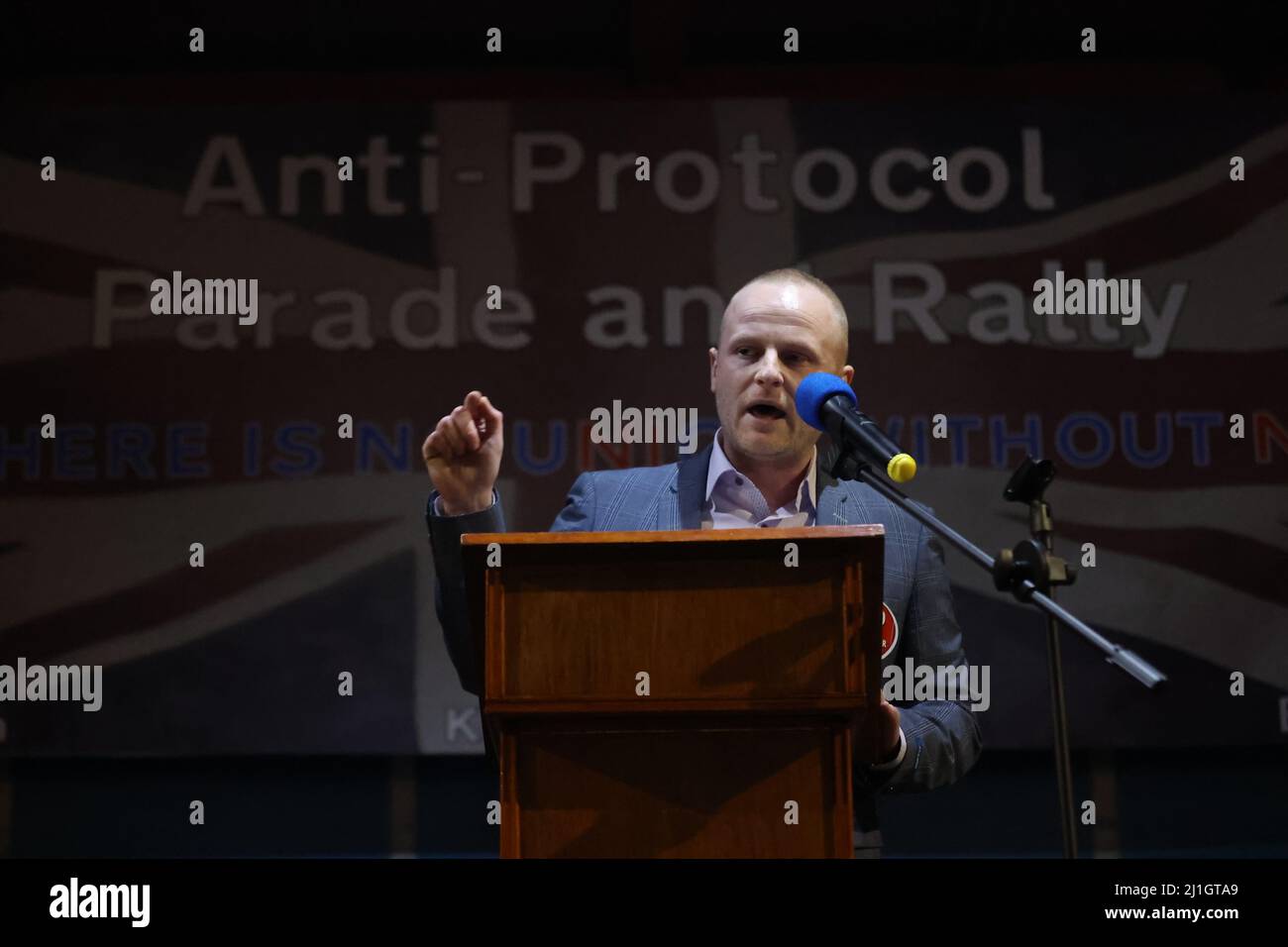 Loyalist blogger Jamie Bryson speaks during a anti Northern Ireland Protocol rally and parade, organised by North Antrim Amalgamated Orange Committee, in Ballymoney, Co Antrim. Picture date: Friday March 25, 2022. Stock Photo